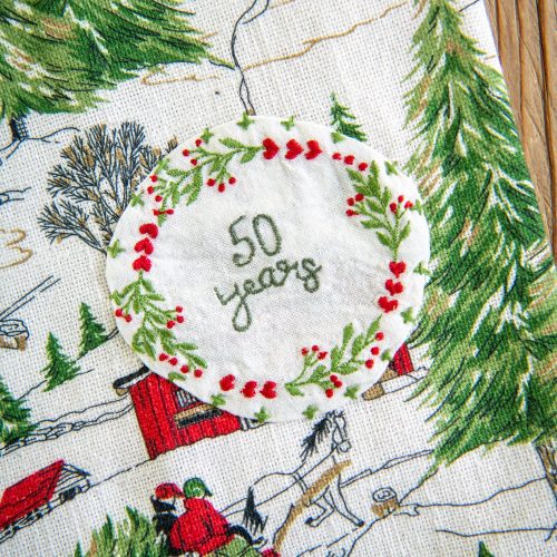 christmas cottage tea towel 50 years 21