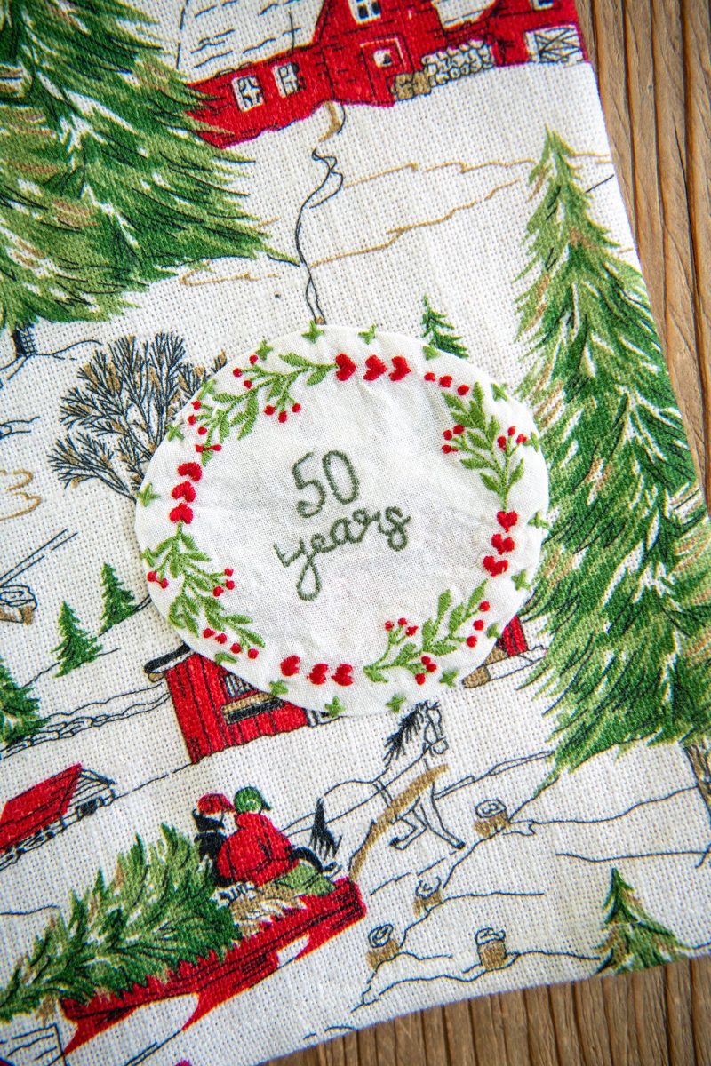 christmas cottage tea towel 50 years 21